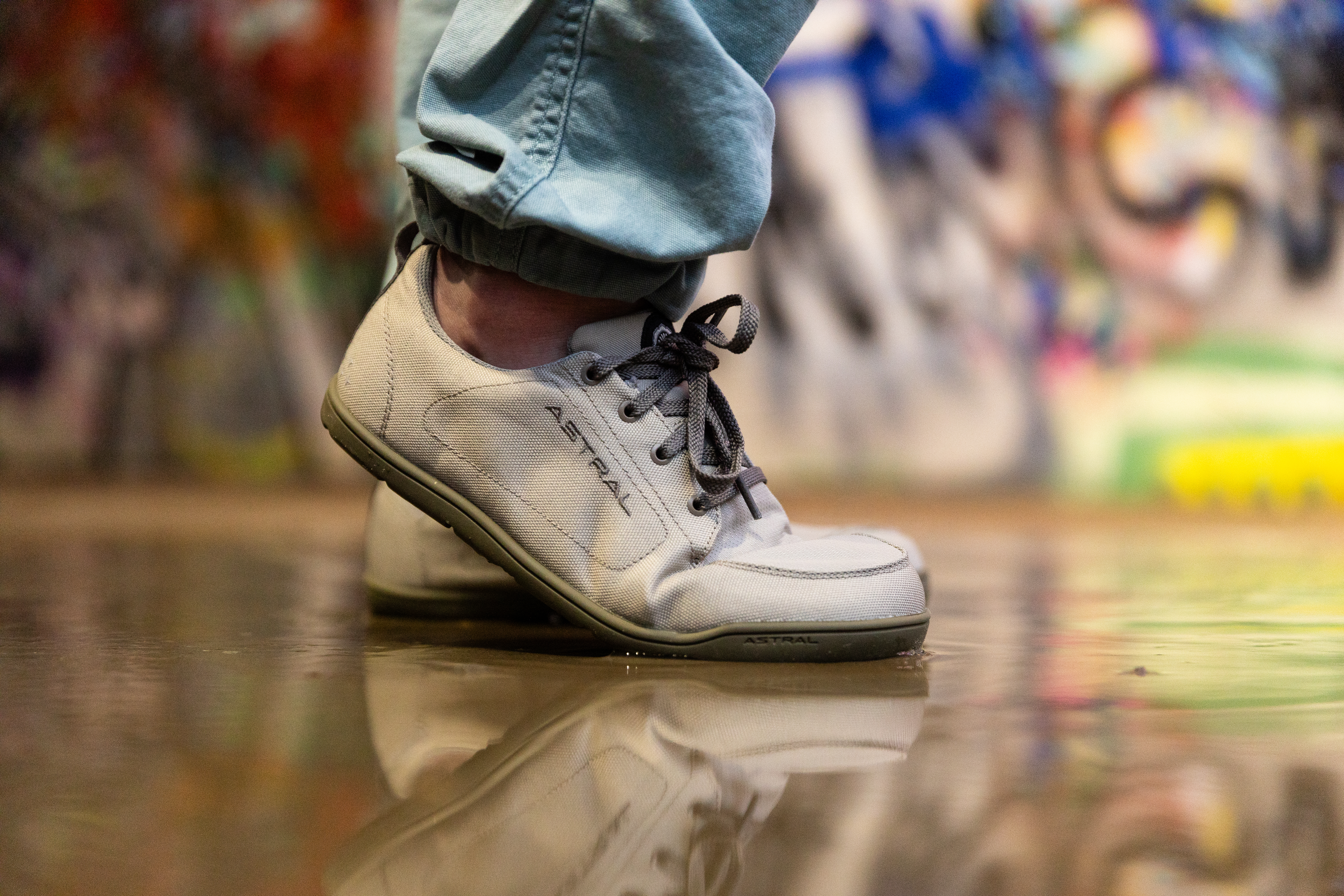 Astral Loyak All Weather strolling down a wet sidewalk