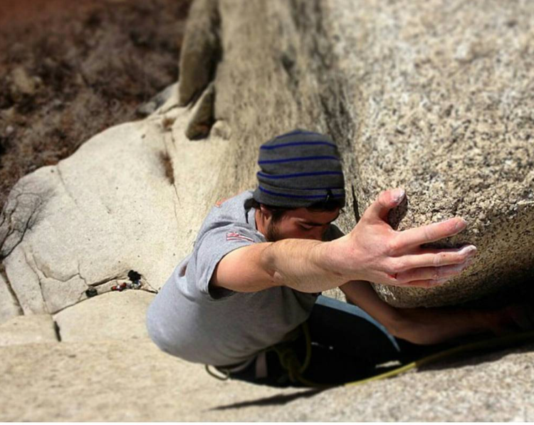 Climber on Bongeater dihedral in Little Cottonwood Canyon