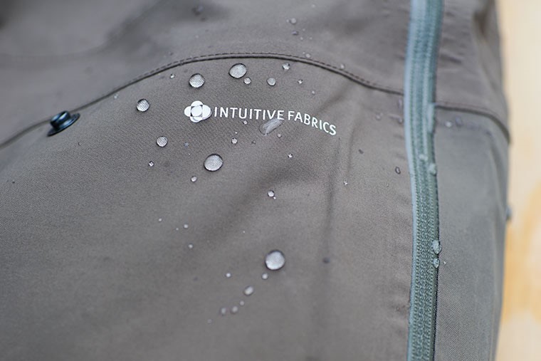Water beading off of the Moxie Bib's Intuitive Fabric