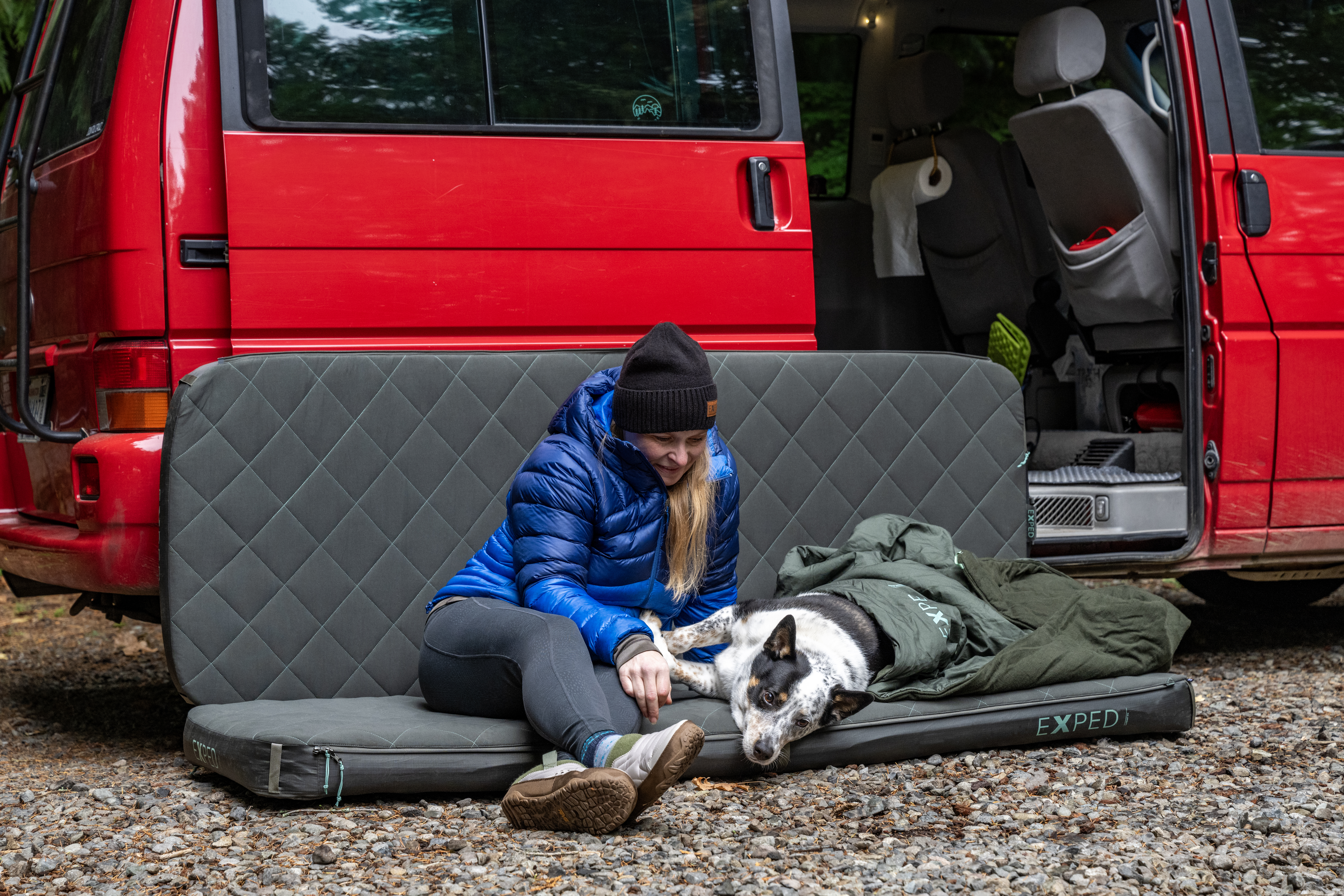 Two packed camping sleeping pads side by side