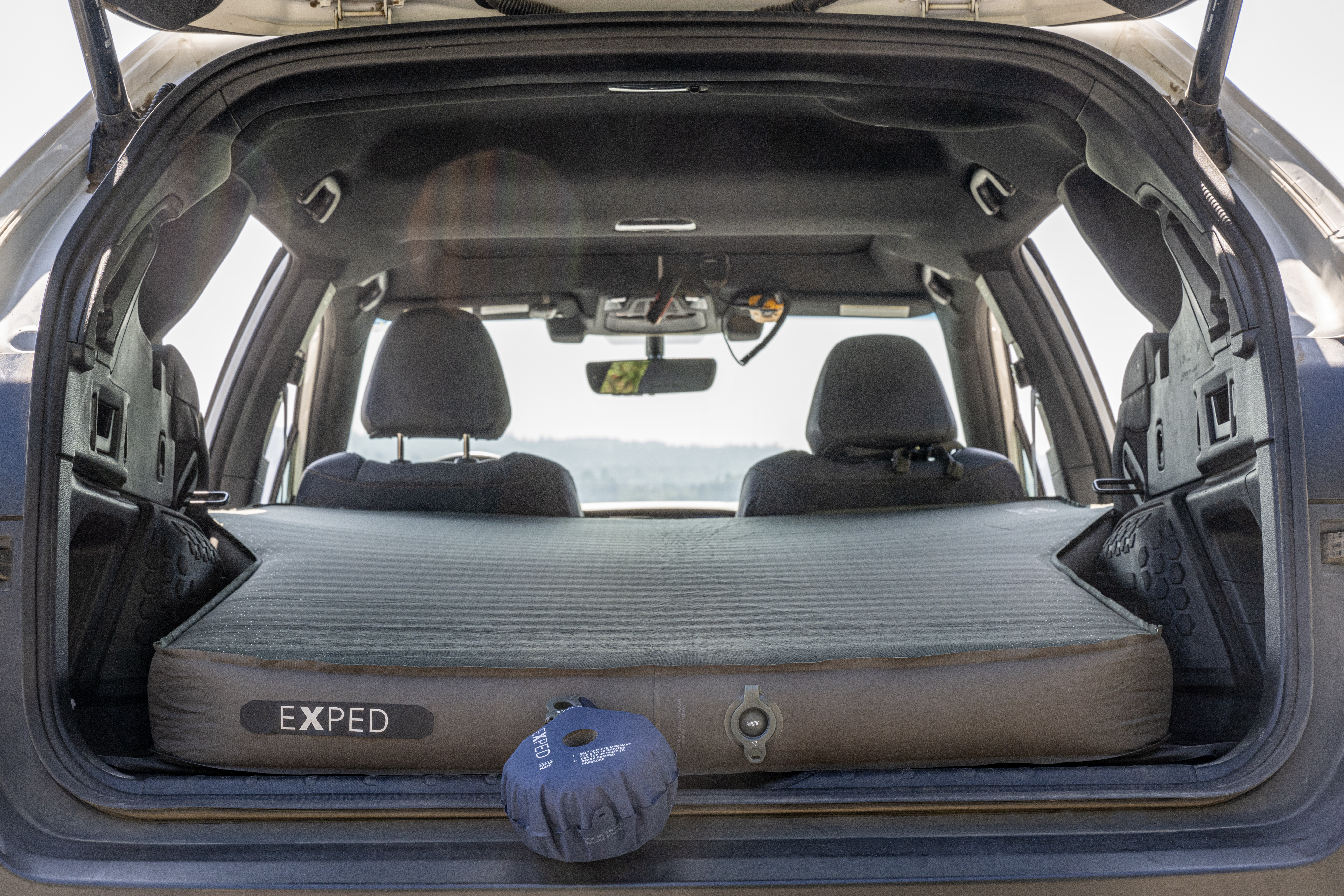 Using a pump sack to top off a self-inflating sleeping pad