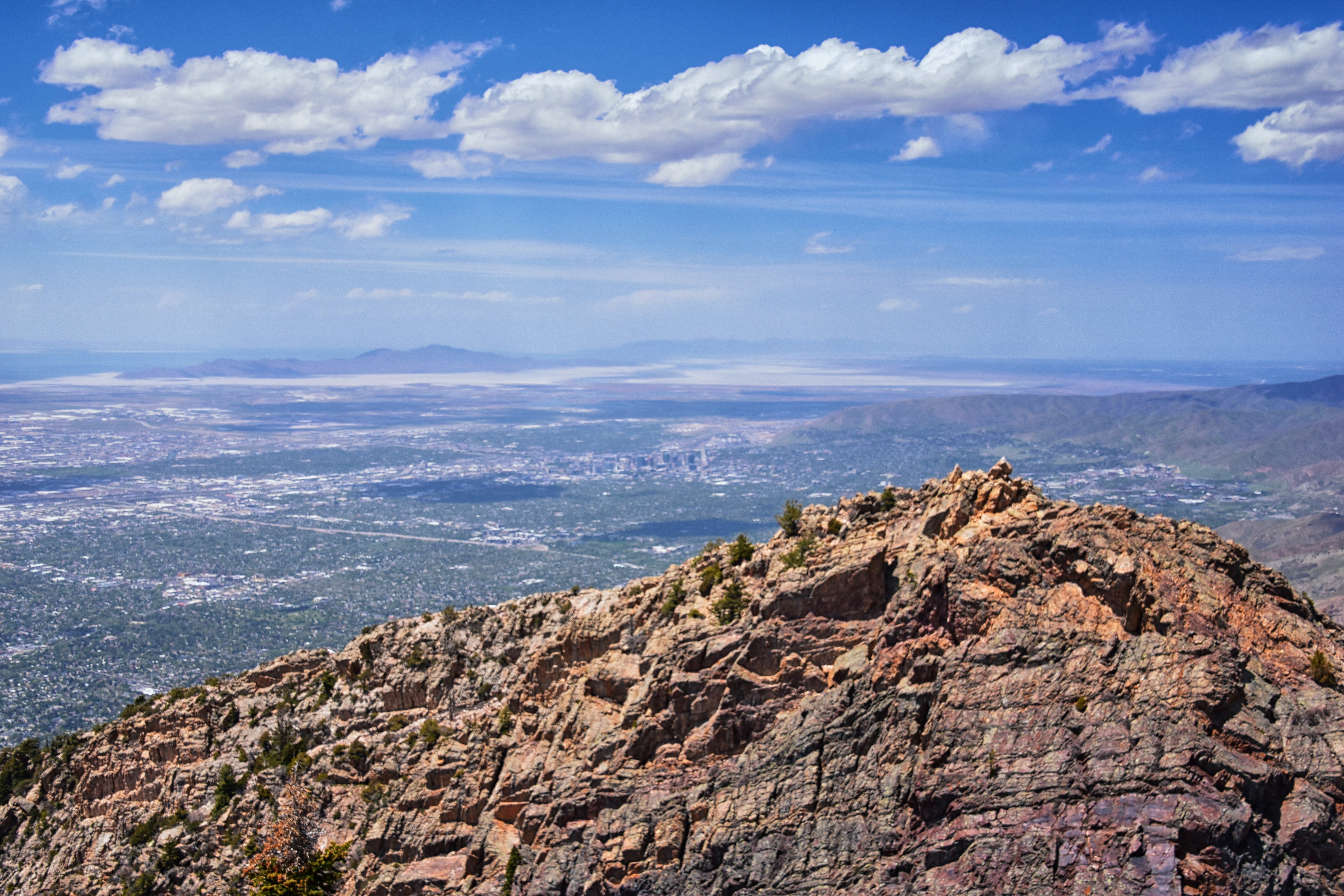 Mount Olympus trail upper quartzite scramble with spring snow, Salt Lake Valley below